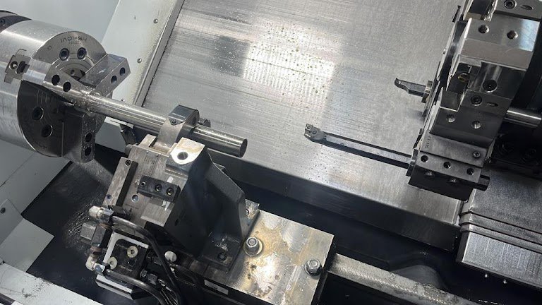 CNC turning machine showing workholding and tooling arrangement